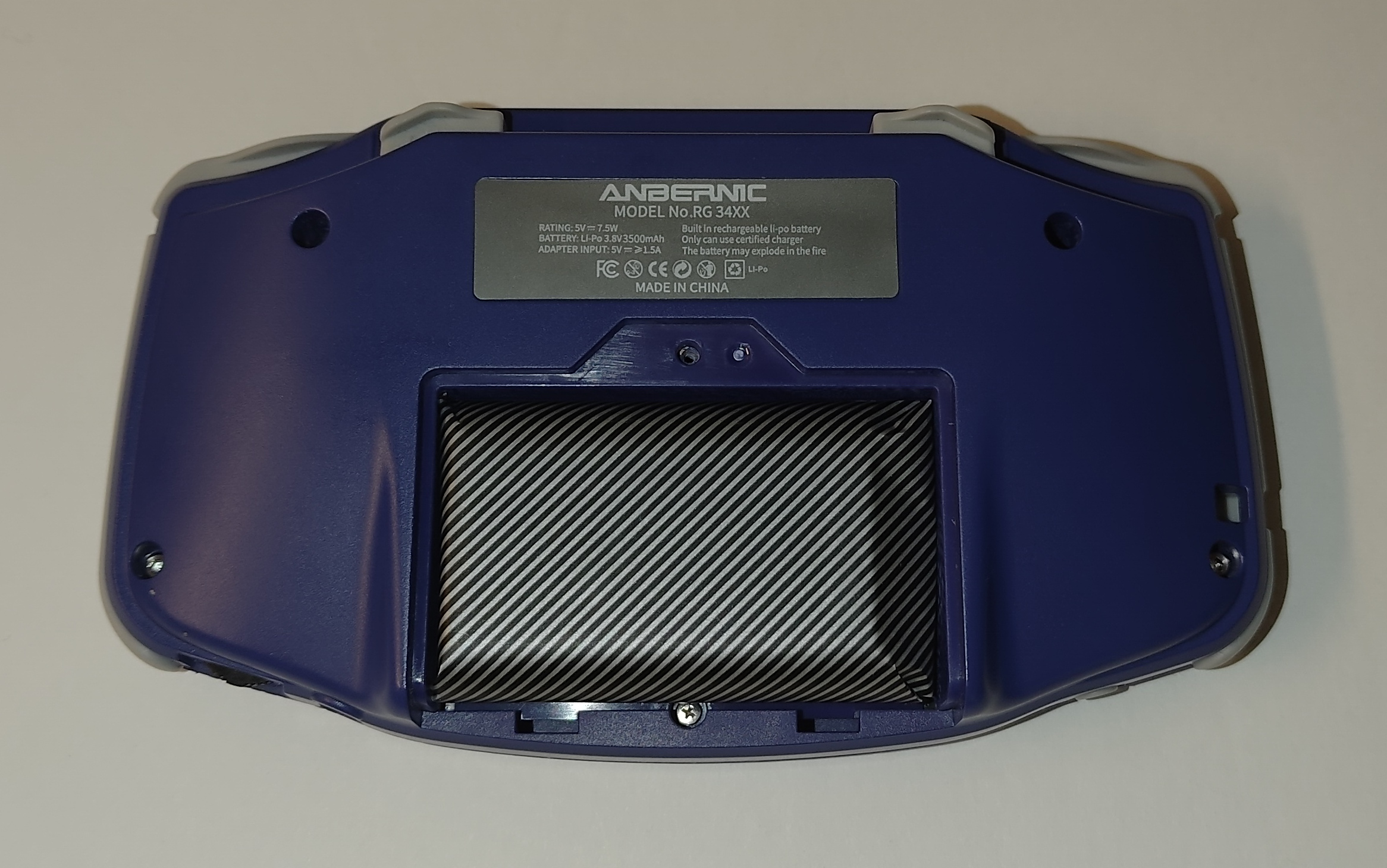 The RG34XX with the battery cover removed